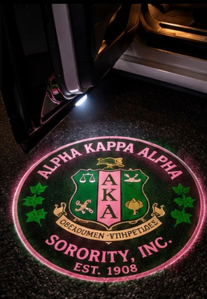 Alpha Kappa Alpha crest projected on pavement