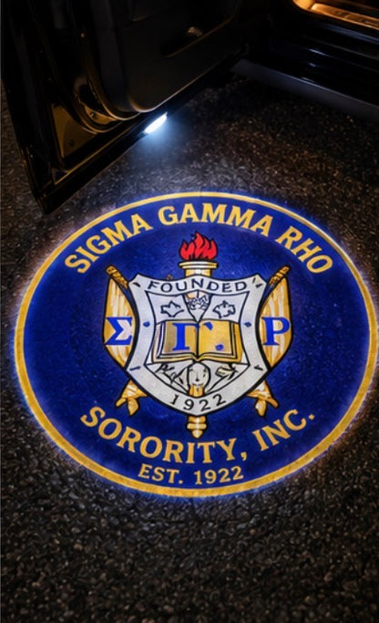 Sigma Gamma Rho crest projected on pavement